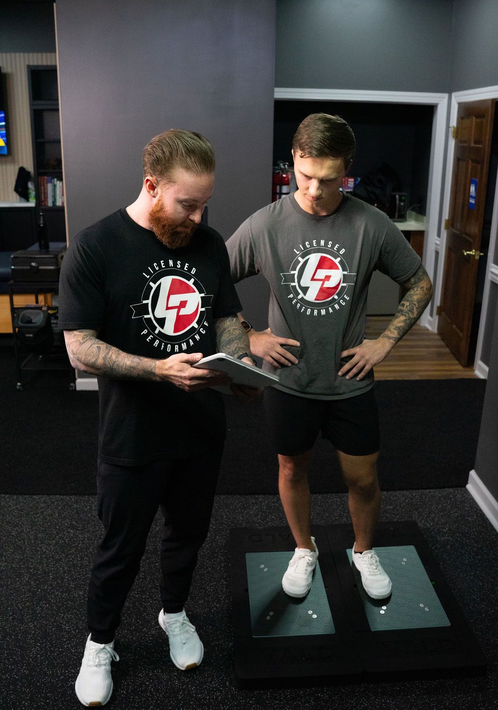 Athlete being screened for movement patterns and weak links.